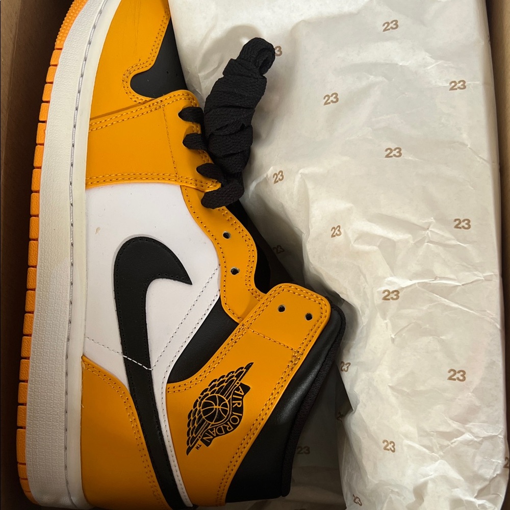 Jordan Men's Black, White, and Orange Sneakers.